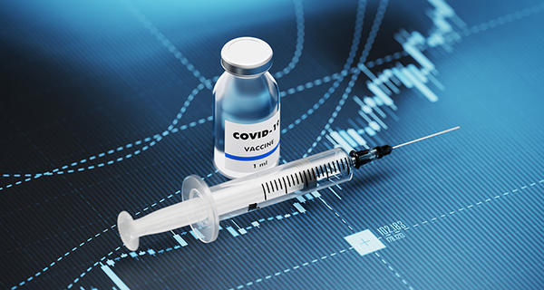 Covid vaccine and syringe