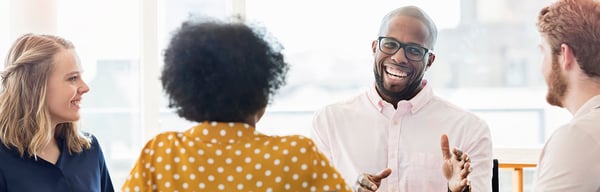 Man smiling in meeting